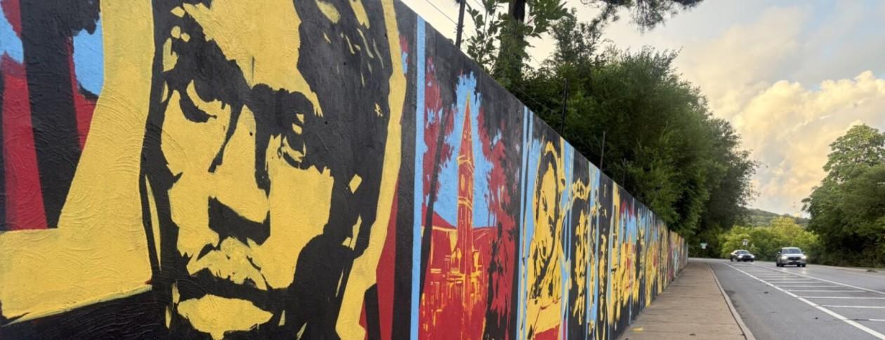 Mural by artist Joelle Storet features an imagined portrait of Nelson Hackett looking down Nelson Hackett Boulevard, an outgrowth of the Nelson Hackett Project.