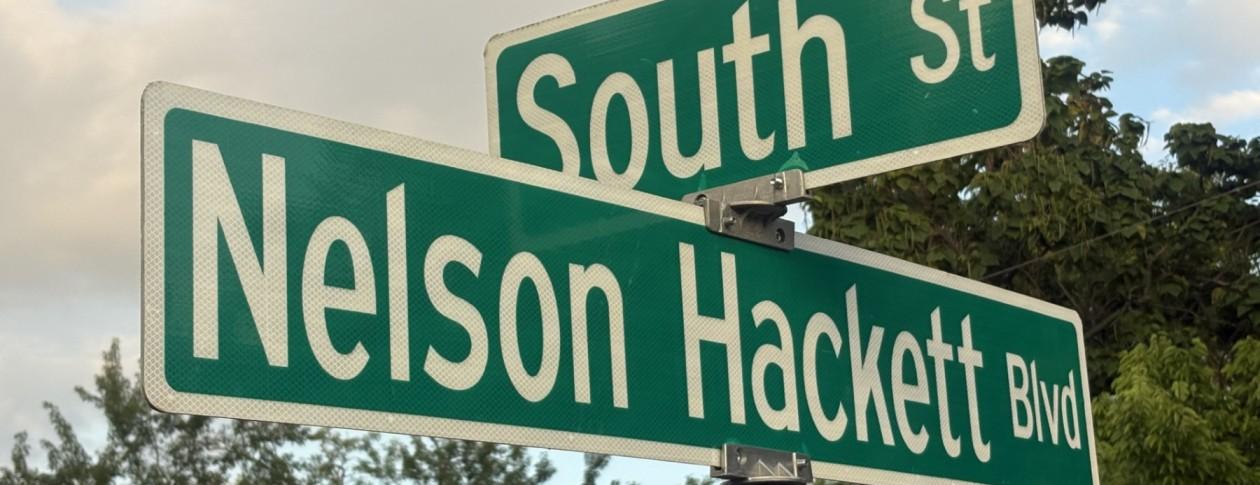 Street sign for Nelson Hackett Boulevard, an outgrowth of the Nelson Hackett Project.